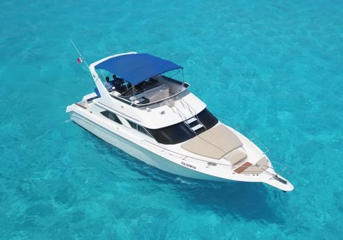 Luxury private yacht cruising through the Caribbean Sea in Cancun.