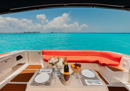 Luxury outdoor dining area onboard the Sin Nombre private yacht in Cancun.