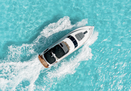 Aerial view of the Fairline 65 luxury yacht cruising in the turquoise waters near Cancun