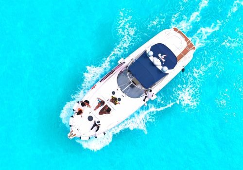 Aerial drone view of the Diva private yacht cruising in Cancun. Alt Text: